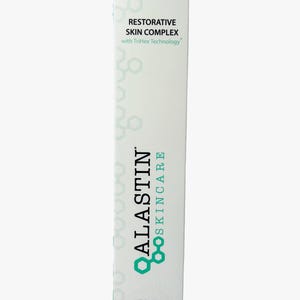 May include: A white skincare product box with the text "ALASTIN SKINCARE" in teal and the words "RESTORATIVE SKIN COMPLEX" in black. The box contains 1.0 fl. oz. or 29.6 mL of product and features a geometric design.