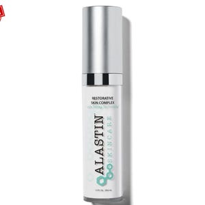 May include: A white and silver skincare product bottle with the text "ALASTIN SKINCARE" and "RESTORATIVE SKIN COMPLEX". The bottle has a silver cap and a "BEST SELLER" sticker in the upper left corner. The bottle contains 1.0 fl oz / 29.6 mL.