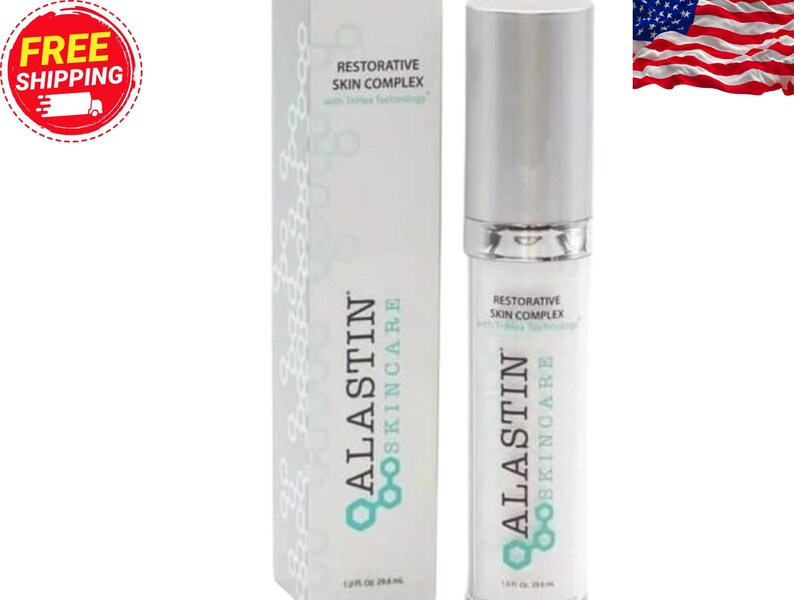 May include: A white and silver skincare product bottle and box. The bottle has a silver cap and the box has the text "ALASTIN SKINCARE" and "RESTORATIVE SKIN COMPLEX". The American flag is in the background.