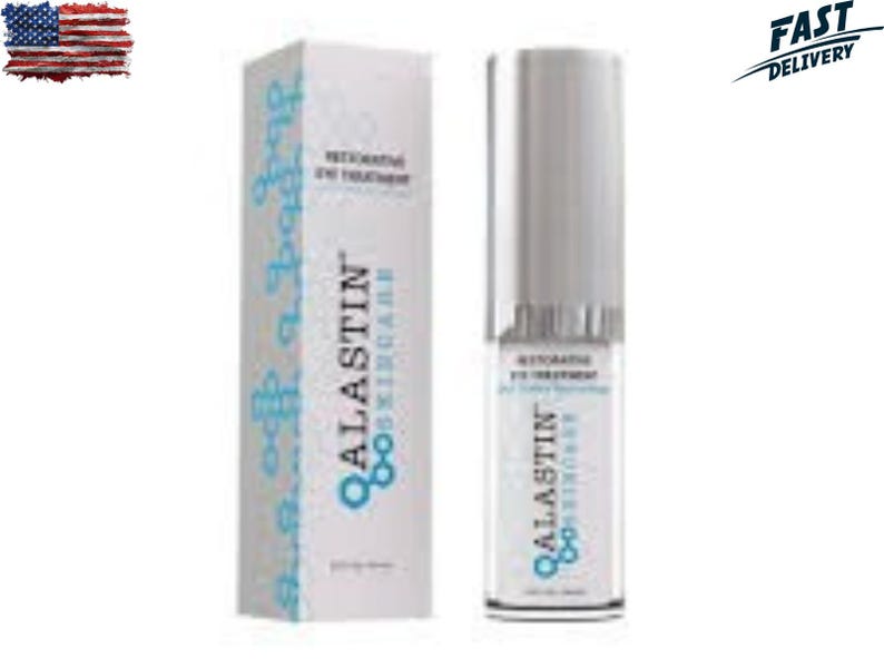 May include: A white box and a cylindrical bottle of Alastin Skincare Restorative Eye Treatment. The box has blue decorative elements and the brand name. The bottle has a silver cap and the product name is visible.