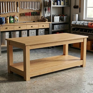 May include: A rectangular wooden workbench featuring a light oak finish, a thick solid top surface, and a lower storage shelf supported by four sturdy legs. The structure is constructed from wood with a natural grain pattern and a smooth finish.