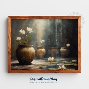 May include: A framed art print shows white lotus flowers and greenery in rustic brown pots. The artwork has a soft, painterly style with a dark, moody background. The text "DigitalProdMag" is at the bottom of the print.