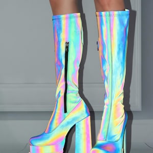 A pair of neon-colored, rainbow-colored platform boots with a high, chunky heel.