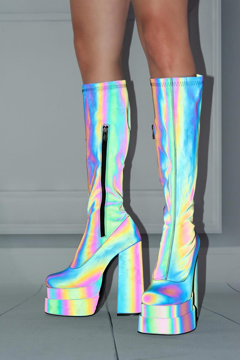 A pair of neon-colored, rainbow-colored platform boots with a high, chunky heel.