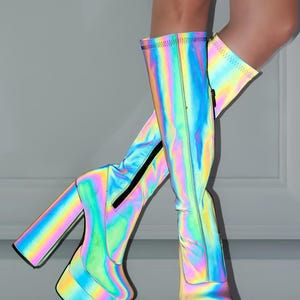 A pair of colorful, rainbow-colored platform boots with a high heel and a zipper closure.