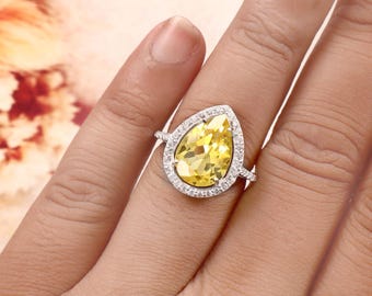 Ring mit birnenförmigem gelbem Saphir, Halo-Fassung aus 925er Sterlingsilber (14 x 10 mm)