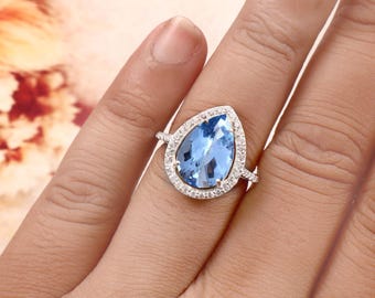 Ring mit birnenförmigem Halo aus himmelblauem Topas, Verlobungsring aus 925er Sterlingsilber (14 x 10 mm)