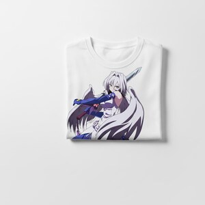 May include: White t-shirt featuring a detailed anime-style illustration of a female character with white hair, wielding a sword. The character is dressed in white and blue armor with large white wings. The shirt is folded.
