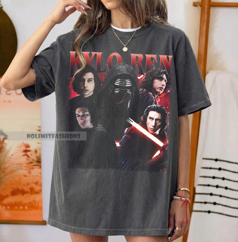 May include: Dark gray t-shirt featuring a graphic of Kylo Ren from Star Wars. The design includes multiple images of the character, with the name "KYLO REN" in red block letters at the top. The shirt has the text "NOLIMITFASHIONS" at the bottom.