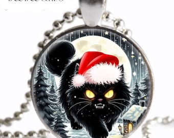 May include: A round pendant necklace featuring a black cat wearing a Santa hat, set against a winter scene with a full moon and snow-covered trees. The pendant is on a silver ball chain. The text "BOOB&REG" is at the top.