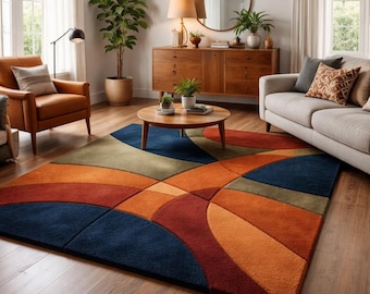 Könnte beinhalten: Ein farbenfroher Teppich mit einem abstrakten Design in Blau-, Orange-, Rot- und Grüntönen. Der Teppich ist rechteckig und weist geschwungene und geometrische Formen auf. Der Teppich liegt auf einem Holzboden in einem Wohnzimmer.