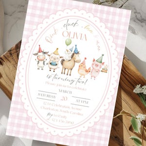 May include: Pink gingham-patterned invitation with an oval frame featuring farm animal illustrations. Text includes "Pink, duck, baa, OLIVIA is turning two!" and event details. The invitation is on a wooden surface.