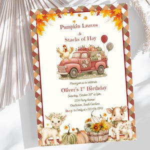 May include: A rectangular invitation card featuring a red truck carrying pumpkins and a chicken, with a fawn and a calf standing below. The text reads: Pumpkin Leaves & Stacks of Hay, Please join us to celebrate Oliver's 1st Birthday, Saturday, October 20th at 1pm, 1234 Party Avenue, Charleston, South Carolina, RSVP to Emily at +123 456 7890.