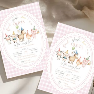 May include: Two pink gingham-patterned birthday invitations. Each invitation features an oval design with farm animal illustrations and the text "Olivia is turning two!" The invitations include event details.