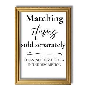 May include: A framed print with gold trim. The text on the print reads "Matching items sold separately" in a mix of fonts. Below the text is a curved line and the text "PLEASE SEE ITEM DETAILS IN THE DESCRIPTION".