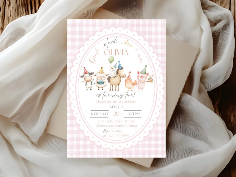May include: A pink gingham-patterned birthday invitation with an oval frame featuring farm animals wearing party hats. The text reads "Olivia is turning two!" and includes event details.