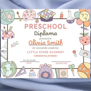 May include: A colourful preschool diploma with illustrations of school supplies and a smiling apple. The diploma is presented to Olivia Smith from Little Stars Academy, dated 05.20.2026. The text reads "Preschool Diploma" and "Congratulations!"