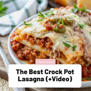 May include: A close-up of a white plate filled with lasagna. The lasagna has layers of pasta, meat sauce, and melted cheese, garnished with fresh herbs and green olives. The text on the image reads "The Best Crock Pot Lasagna (+Video)".