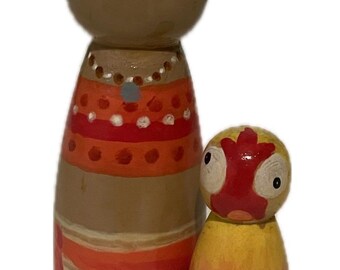 Moana and Hei Hei painted wooden peg dolls.