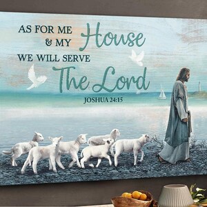 May include: A canvas print with a coastal scene and the text "As for me & my house we will serve the Lord Joshua 24:15." The image shows Jesus with lambs, doves, and a lighthouse, evoking a sense of peace and faith.