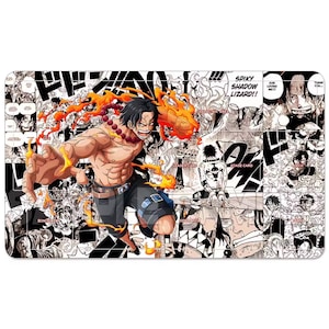 May include: A rectangular playmat featuring a dynamic illustration of a character with fiery energy, set against a backdrop of manga panels in black and white. The character is depicted with flames and a determined expression.