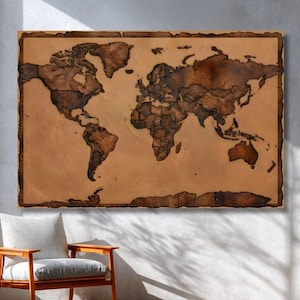 May include: A rectangular wall map featuring a world map design with dark brown wooden continents set against a lighter tan background. The map is enclosed within a dark brown border that features a decorative stitched pattern along the edges.