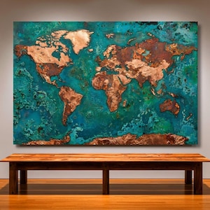 May include: A large, rectangular wall art piece depicting a world map. The continents are rendered in copper against a teal and turquoise background. The artwork is displayed above a wooden bench.
