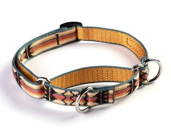 May include: A woven dog collar featuring a geometric pattern in orange, pink, black, and white. The collar has a gold base with a teal border and silver metal rings.