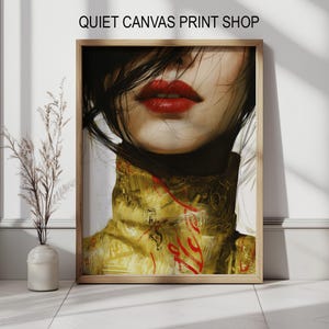May include: A framed art print featuring a close-up of a woman's face. The artwork highlights the red lips and part of the face, with black hair and a golden-yellow top. The text "QUIET CANVAS PRINT SHOP" is at the top.