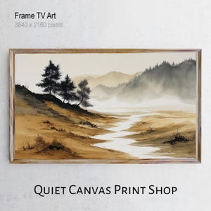 May include: A framed landscape print featuring a serene river winding through a valley, with mountains in the background. The artwork has a watercolor style with muted tones of brown, beige, and green. The text "Frame TV Art" and "QUIET CANVAS PRINT SHOP" are visible.