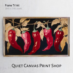 May include: A framed painting featuring five red chillies suspended from a vine against a black backdrop. The chillies have green stems and are set against tan leaves. The frame is light brown. Text at the top reads "Frame TV Art" and at the bottom "QUIET CANVAS PRINT SHOP".