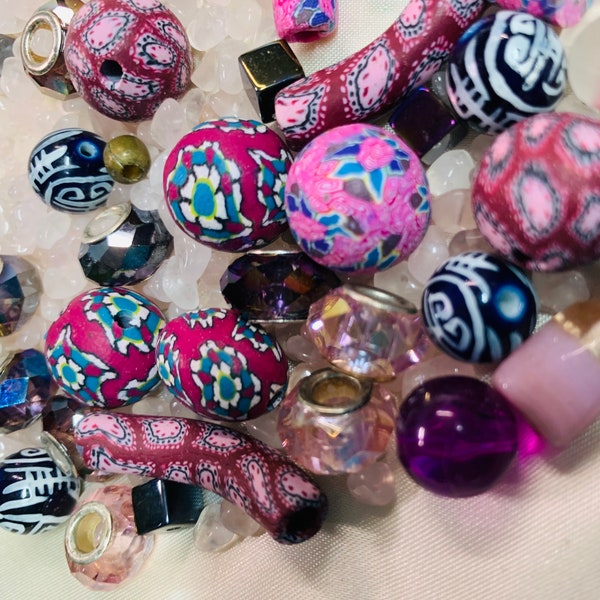 Lot of glass, chip stone, fimo clay and iridescent bead lot.  All in pink and purple tones.