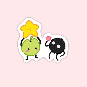 May include: A green apple with a star on its head and a black and white fuzzy creature with a pink flower on its head.
