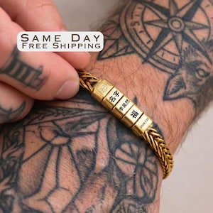 May include: A gold-toned wheat chain bracelet featuring four rectangular beads engraved with Chinese characters and the date 2026.7.22. The bracelet is displayed on a tattooed arm, with a white label reading Same Day Free Shipping.