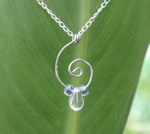 Items similar to Silver swirl necklace with glass bead drop on Etsy
