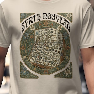 May include: Cream-colored t-shirt featuring a detailed graphic. The design includes the text "SYNTH ROUVERN" in a stylized font, surrounding a circular image of a modular synthesizer. The graphic is framed with floral and geometric elements.