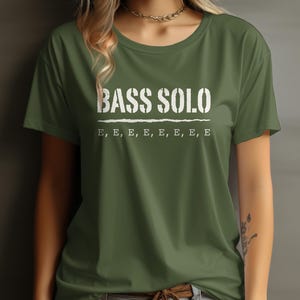 Olive green t-shirt with white "BASS SOLO" and repeated "E" text.