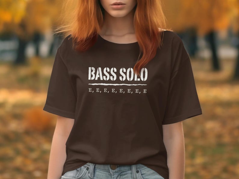 Brown t-shirt with white text "BASS SOLO" and "E, E, E, E, E, E, E, E".