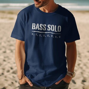 Navy t-shirt with "BASS SOLO" and repeated "E" text.