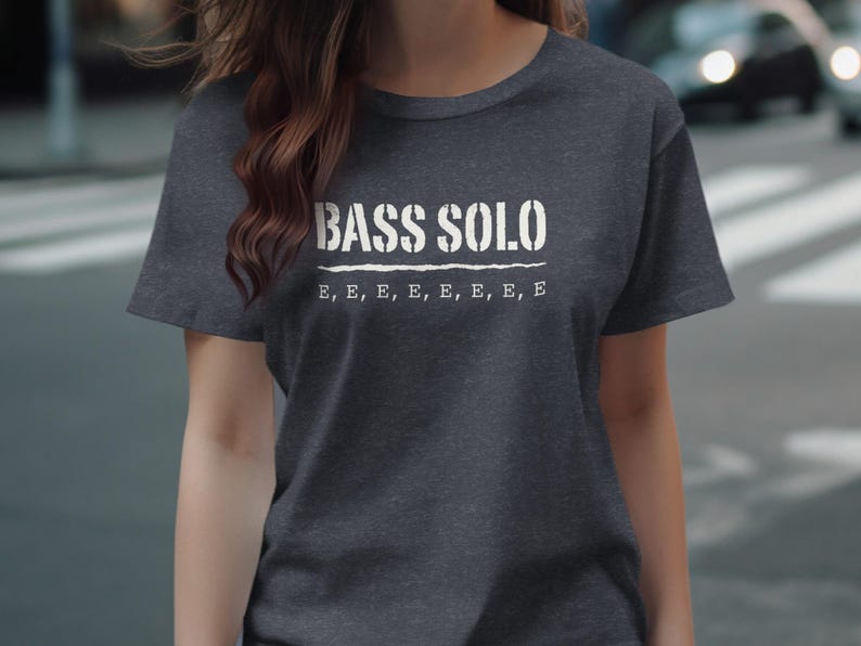 Dark gray t-shirt with white stencil text "BASS SOLO" and "E, E, E, E, E, E, E".