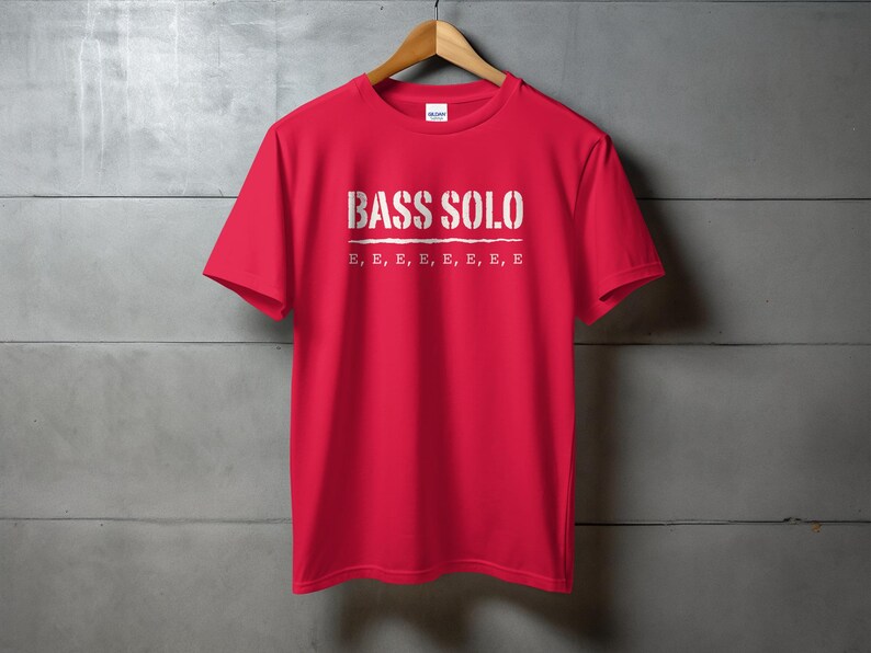 Red t-shirt with "BASS SOLO" and multiple "E"s printed on the chest.