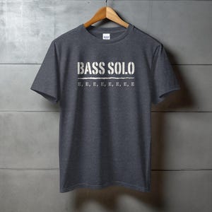 Dark grey t-shirt with "BASS SOLO" and repeated "E"s printed on chest.