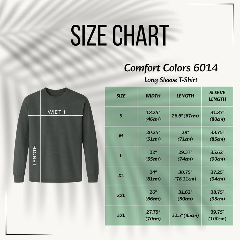 May include: A size chart for a Comfort Colors 6014 long sleeve t-shirt. The graphic displays a dark gray long sleeve t-shirt with white lines indicating width and length measurements, alongside a table listing sizes S to 3XL with imperial measurements.