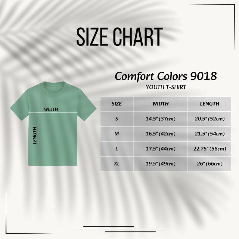 May include: A size chart for a Comfort Colors 9018 youth t-shirt. The graphic shows a light green t-shirt with width and length lines, alongside a table listing sizes S, M, L, and XL with corresponding measurements in inches from 14.5 to 26 inches.