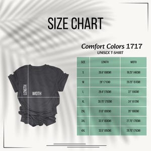May include: A size chart for a Comfort Colors 1717 unisex t-shirt. The image displays a dark gray t-shirt with length and width lines, alongside a table listing sizes S through 4XL with corresponding measurements in inches and centimeters.