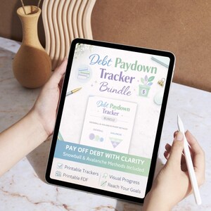 May include: A digital tablet displaying a "Debt Paydown Tracker Bundle" with the text "Pay Off Debt With Clarity." The screen shows options for printable trackers, visual progress, and reaching goals. A stylus is held nearby.