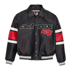 May include: Black leather jacket with the text "Avirex" in white and red lettering. The jacket features red and white stripes on the sleeves and a white and black striped hem and cuffs. The number "4" is displayed in red.
