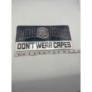 Open Road Brands Real Heroes Don't Wear Capes Police Metal Sign 12x6 New image 3