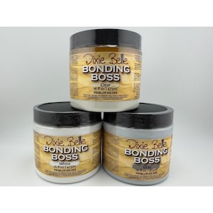 May include: Three 16 fl oz jars of Dixie Belle Bonding Boss problem solver primer. The top jar is clear, while the bottom two jars are white and gray. Each container features a black screw-top lid and a label with the product name and volume.