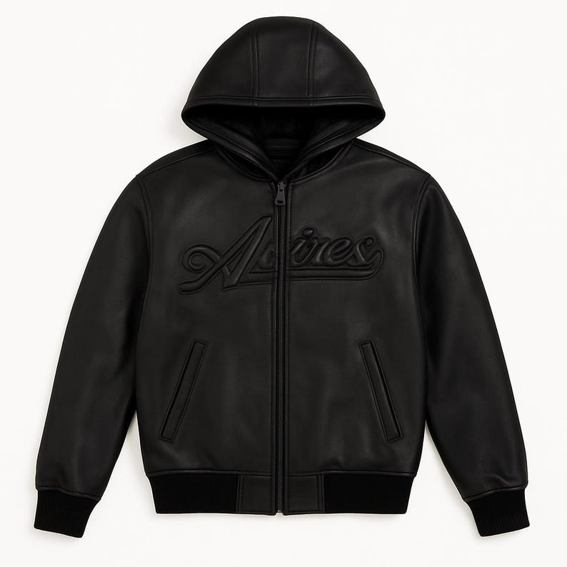 May include: Black leather hooded jacket with a zip-up front and the word "Adires" embossed on the chest. The jacket features a ribbed hem and cuffs, and two front pockets. The hood is lined with a darker material.